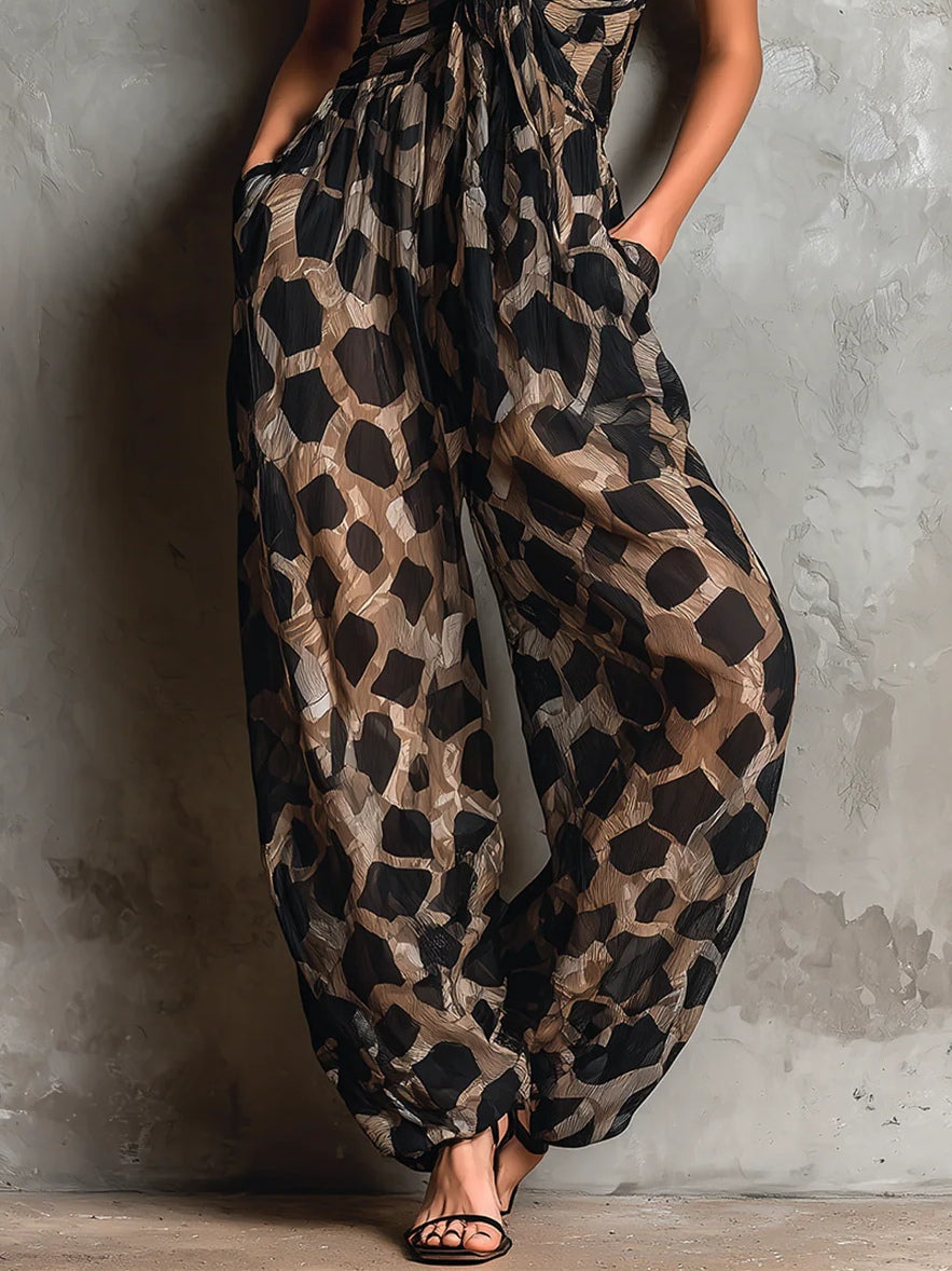 Roberta | Mono de gasa negro con estampado animal