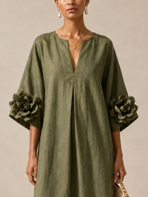 Emma | Vestido midi verde oliva con escote en V y detalle de camelia