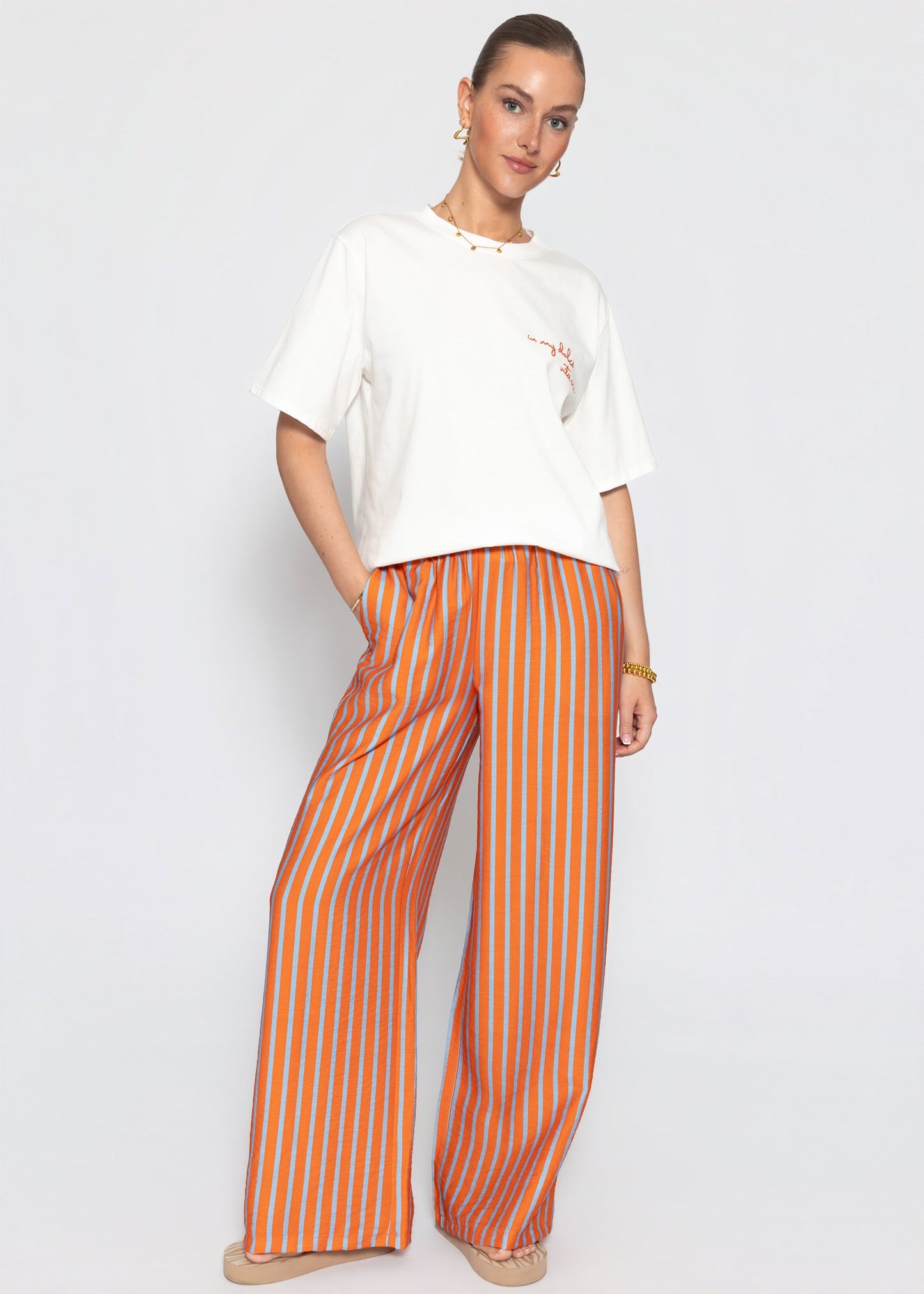 Ariadna | Pantalón a rayas · Naranja