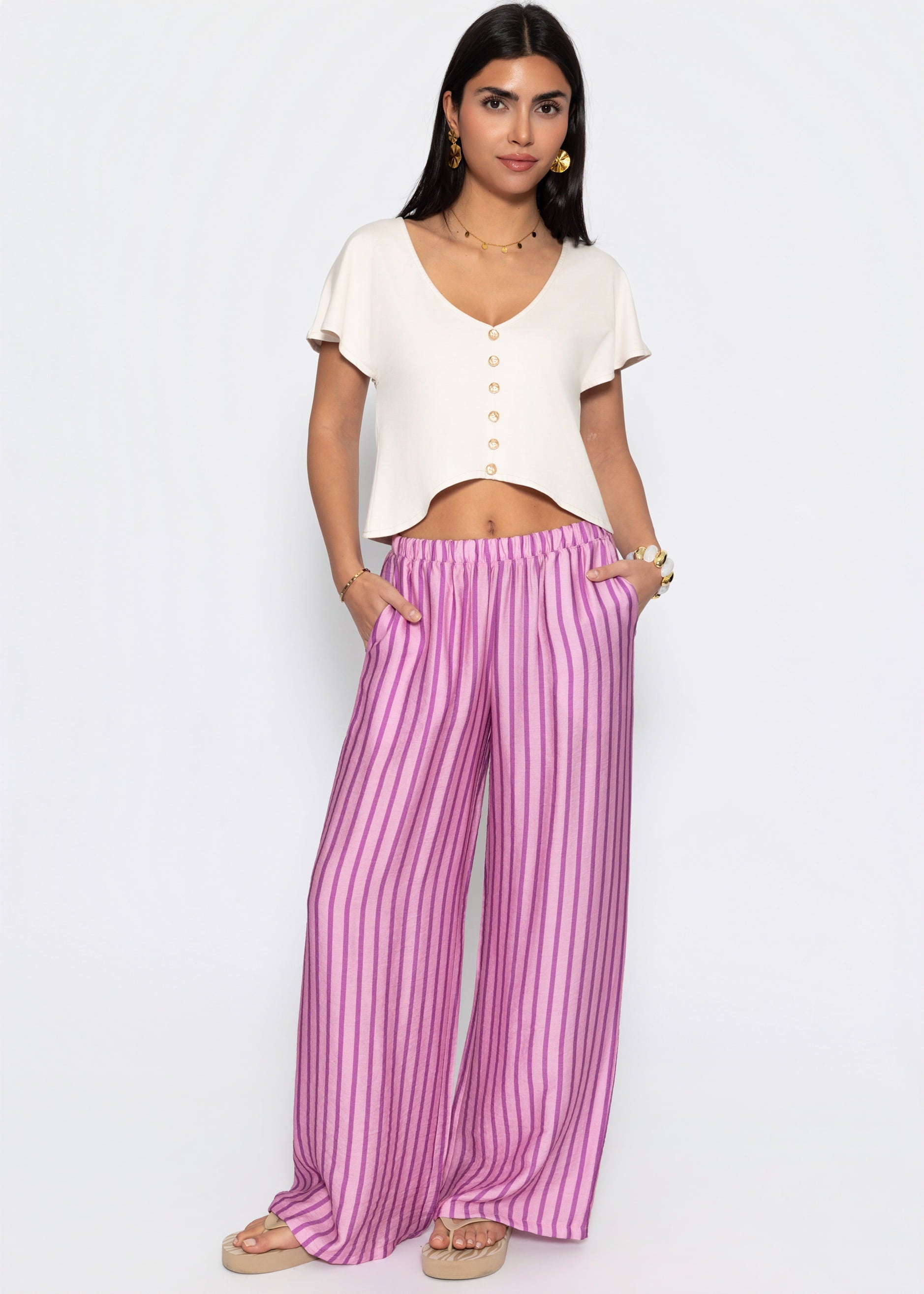 Nira | Pantalón a rayas · Rosa