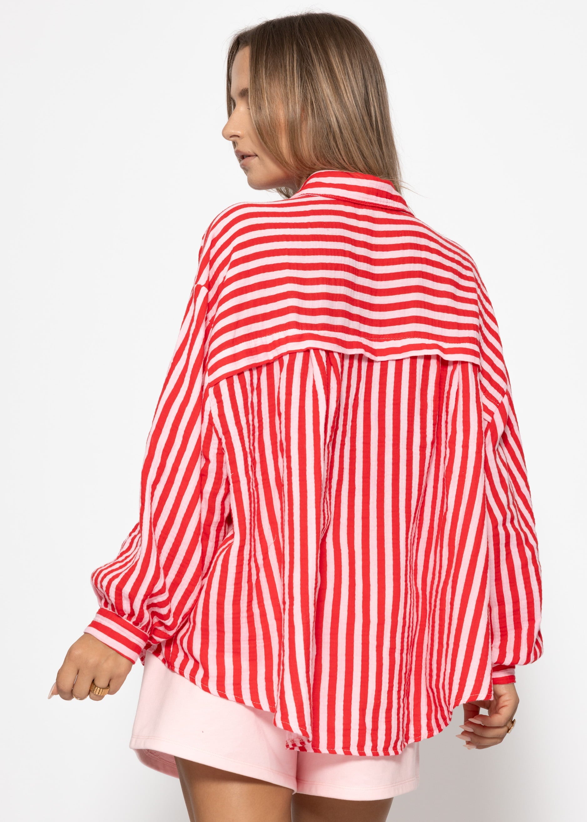 Daniela | Blusa oversize de muselina a rayas · Rojo y fucsia