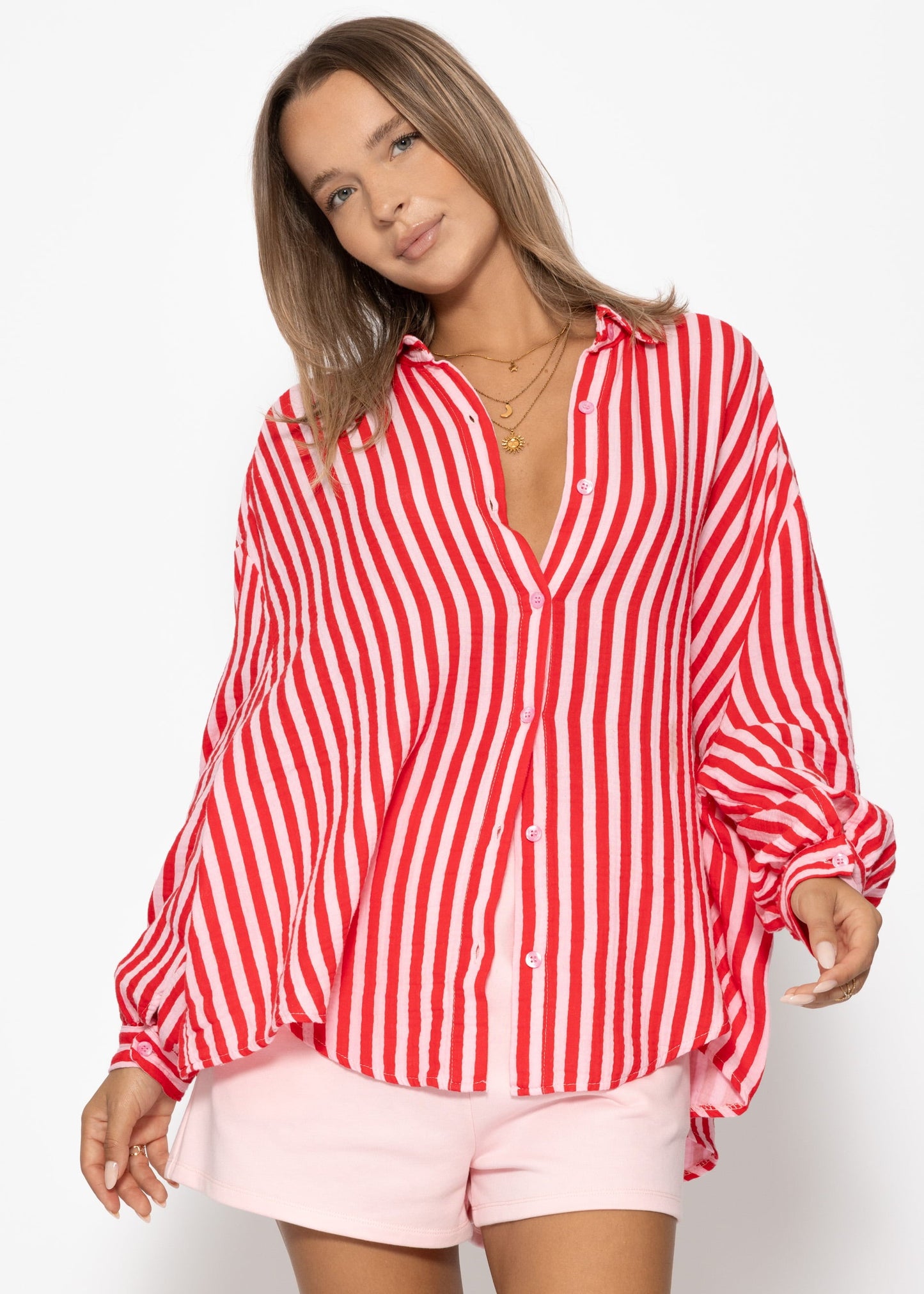Daniela | Blusa oversize de muselina a rayas · Rojo y fucsia